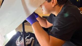 My main roles were processing oceanographic data and samples. Here I am photographing an Octopus. Credit: Dr Diva Amon 